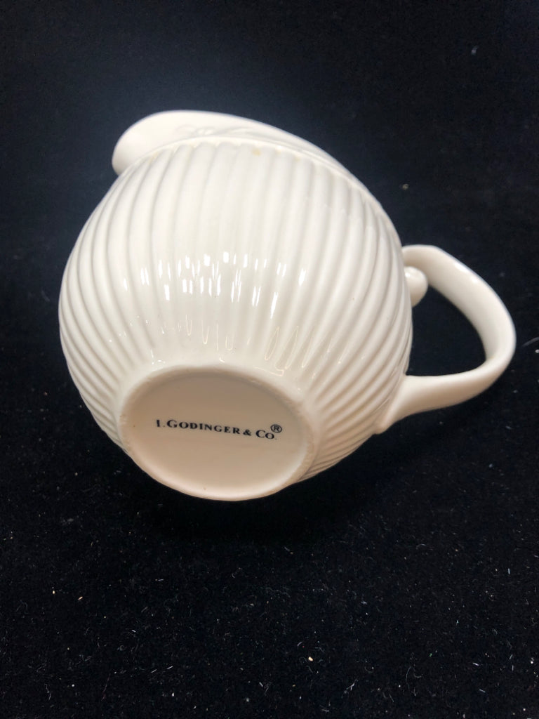 IVORY PITCHER EMBOSSED VINE LEAF PATTERN.