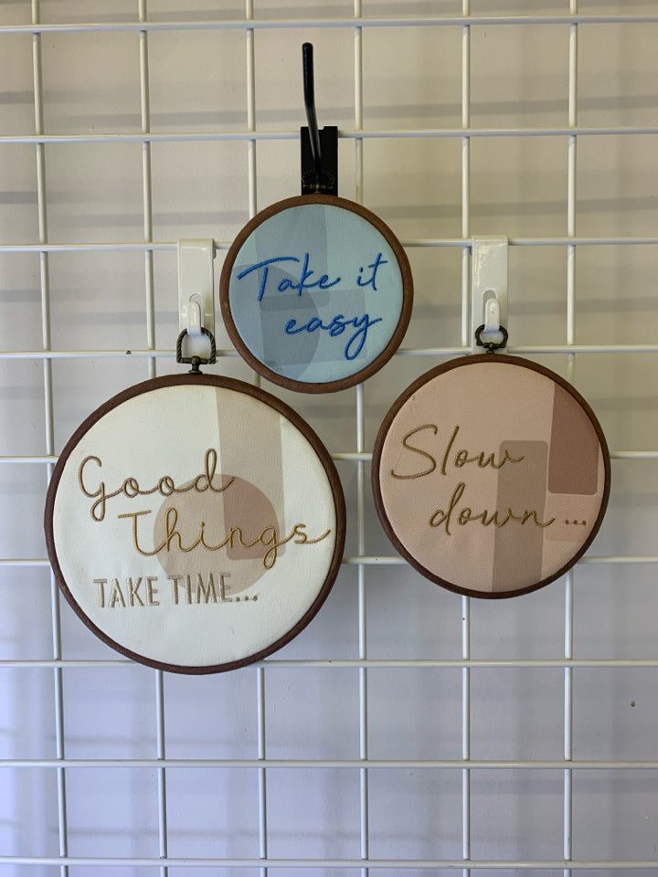 "TAKE IT EASY" 3PC ROUND FABRIC WALL HANGING W/ WOOD FRAME.