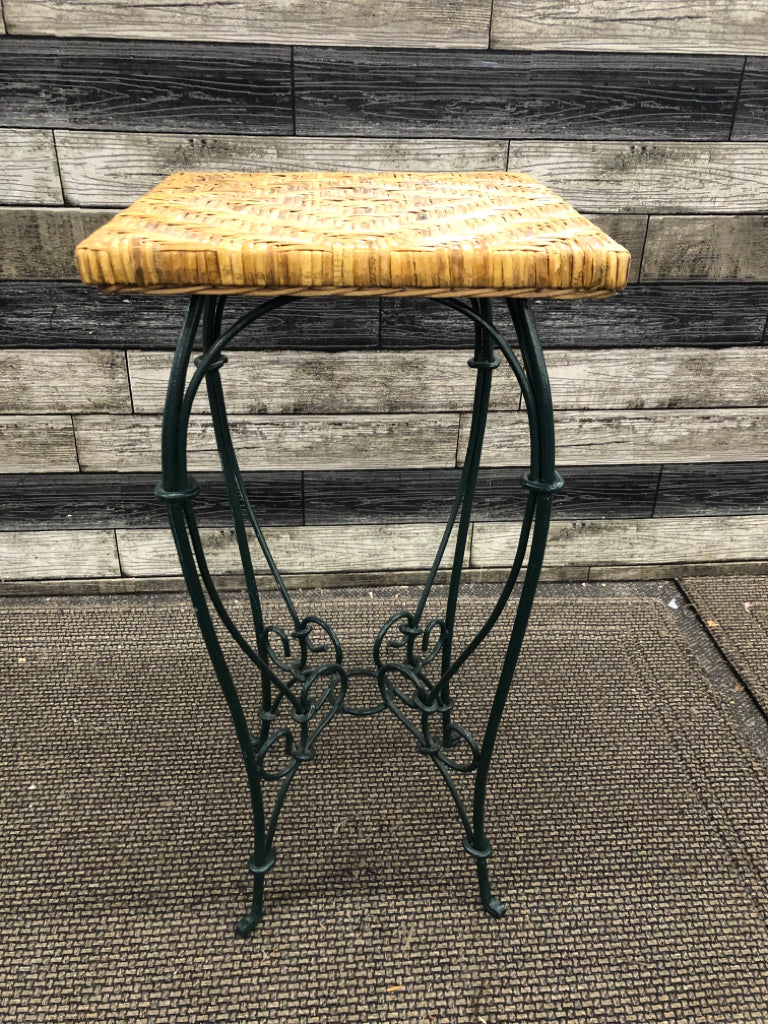 GREEN METAL WICKER PLANT STAND.