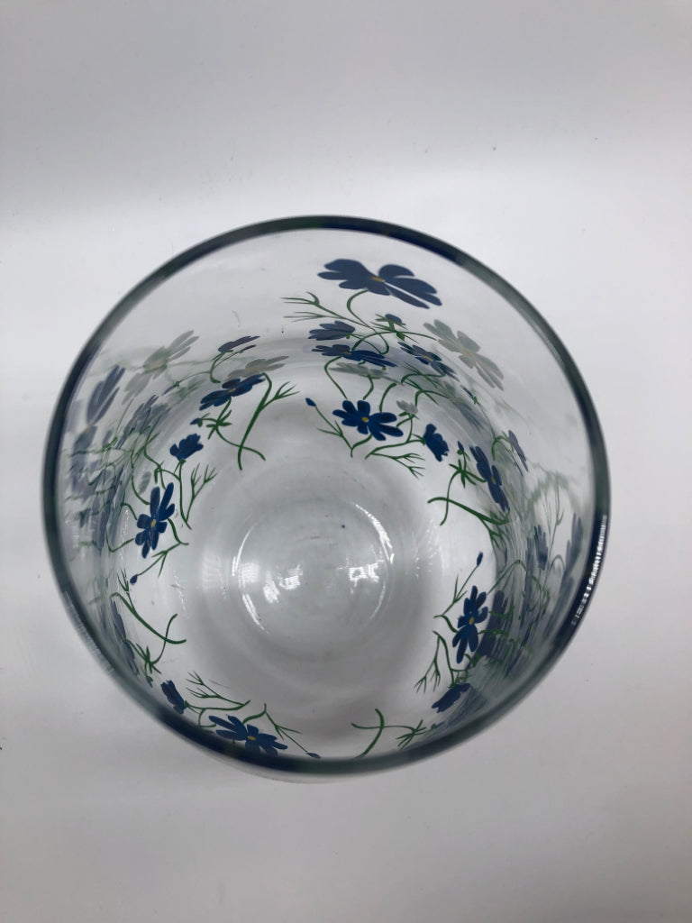 CLEAR VASE W/ BLUE AND WHITE FLOWERS PAINTED.