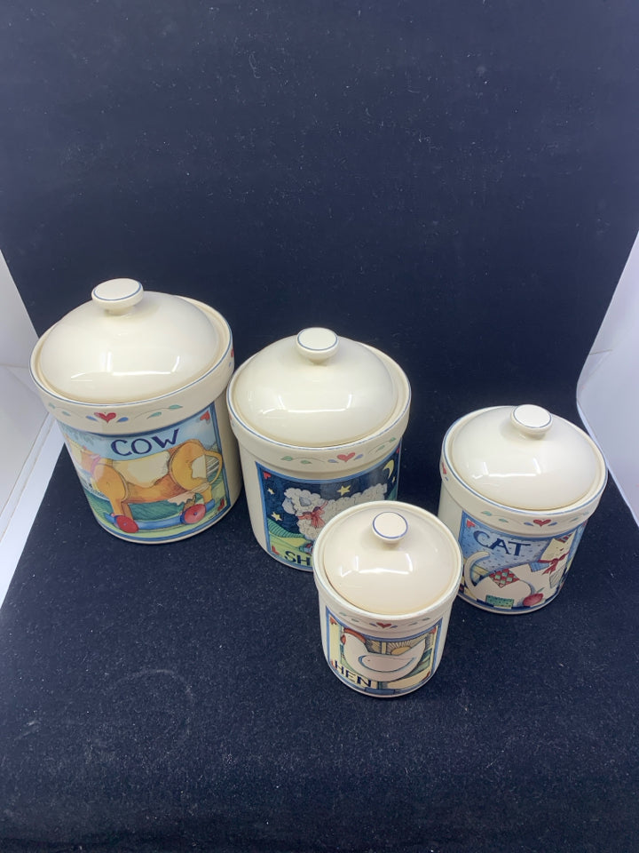 4 PRIMITIVE ANIMAL CANISTERS.