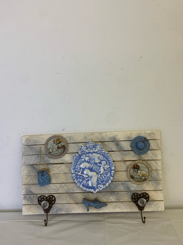 WOOD WALL HANGING W BLUE ACCENTS AND 2 HOOKS.