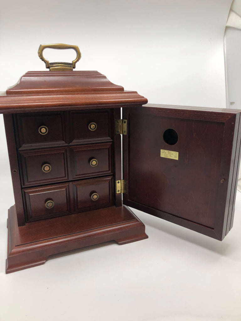 SLIGH CLOCK W/ 3 DRAWERS INSIDE.