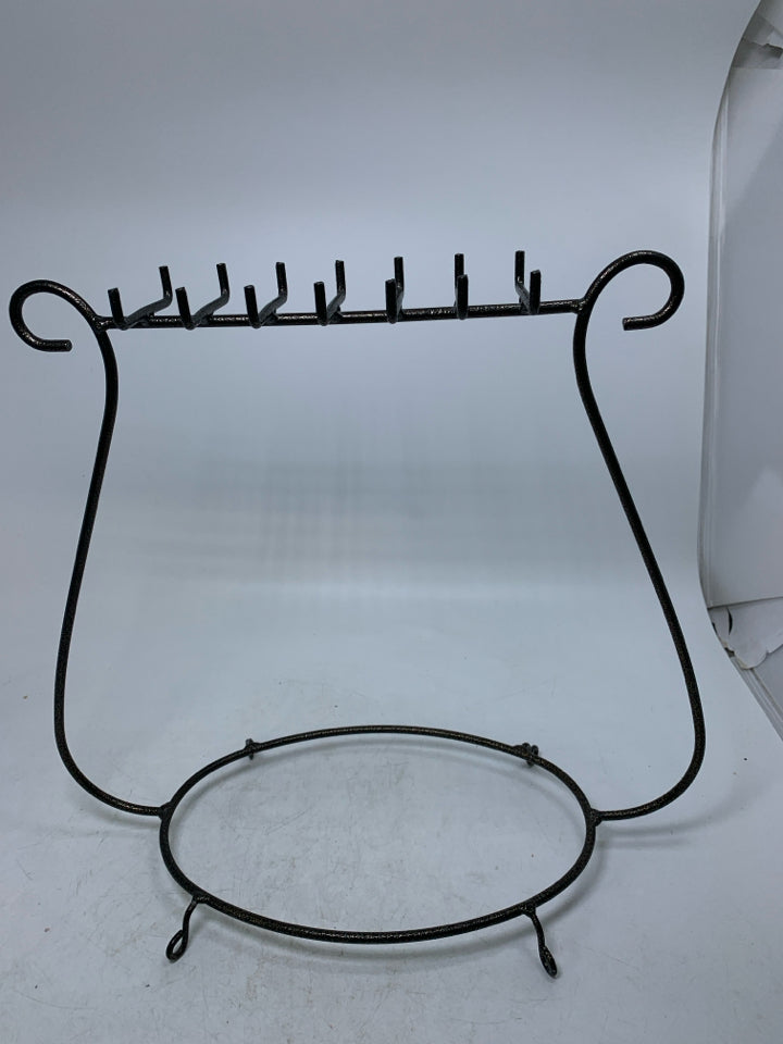 BROWN METAL NECKLACE HOLDER.