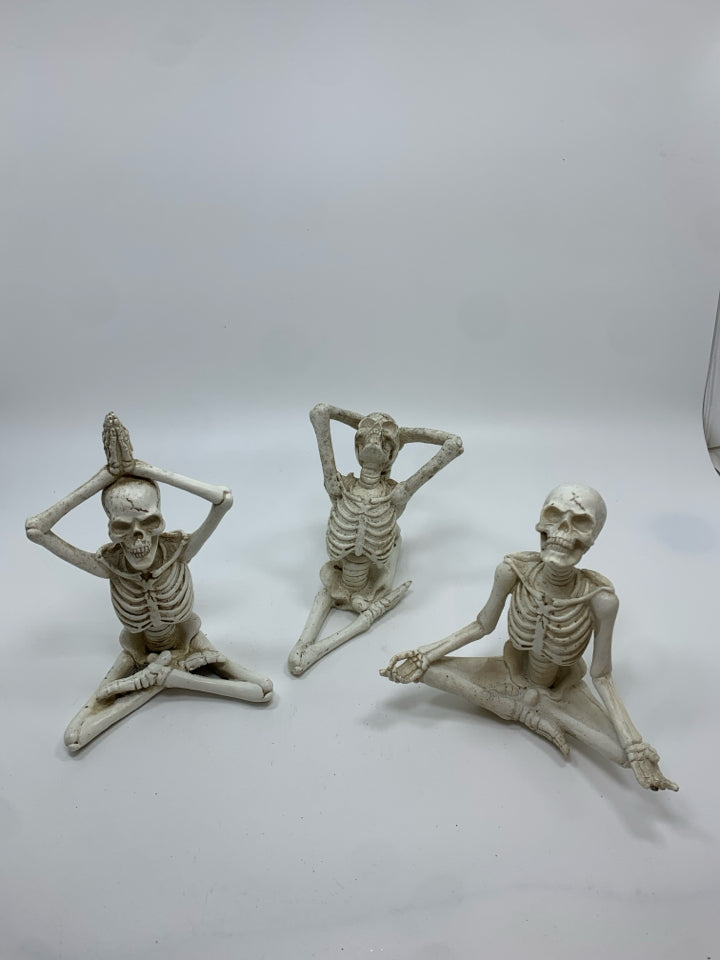 3 YOGA RESIN SKELETONS.