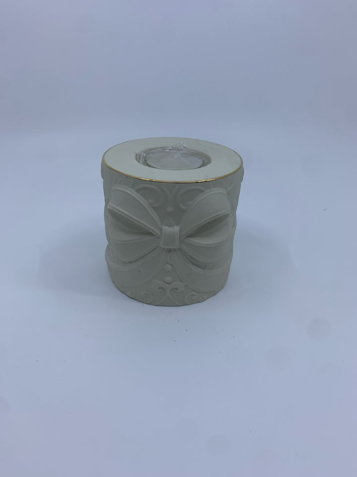 RADIANT LIGHT TEA LIGHT HOLDER W EMBOSSED BOW.