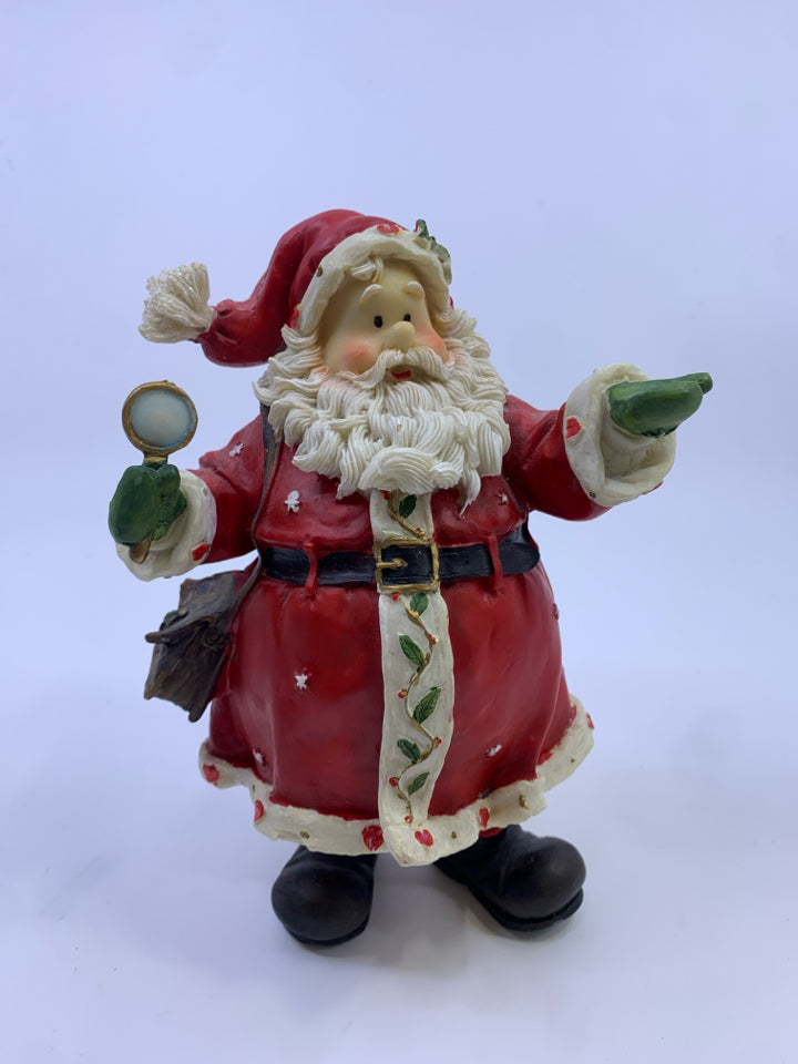 RESIN SANTA HOLDING OUT HIS HAND GREEN MITTEN.