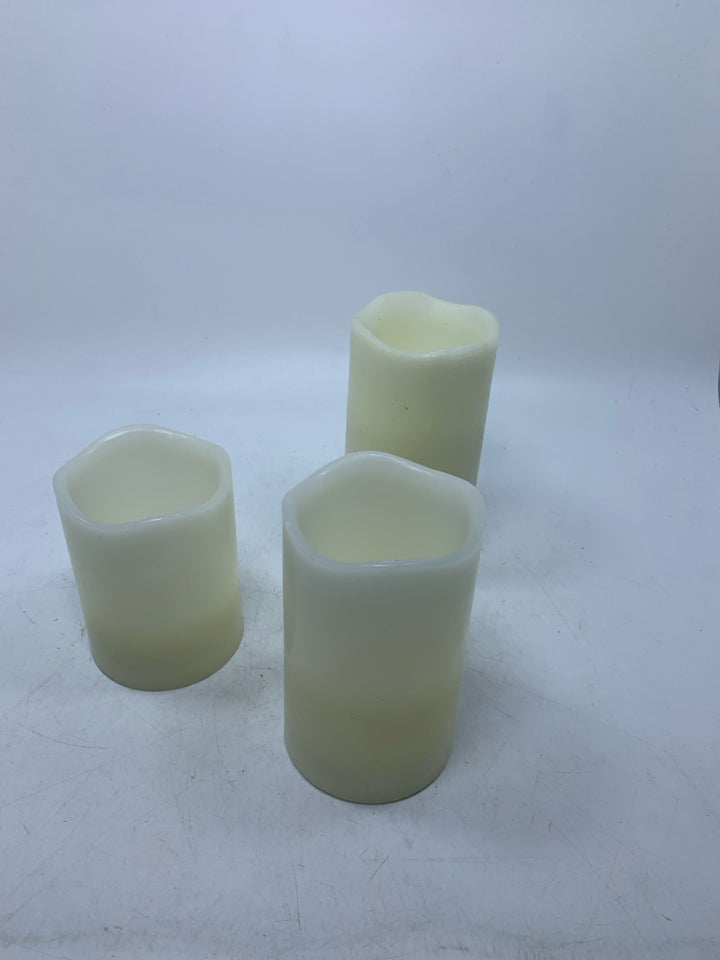 3 FAUX BATTERY POWERED CANDLES.