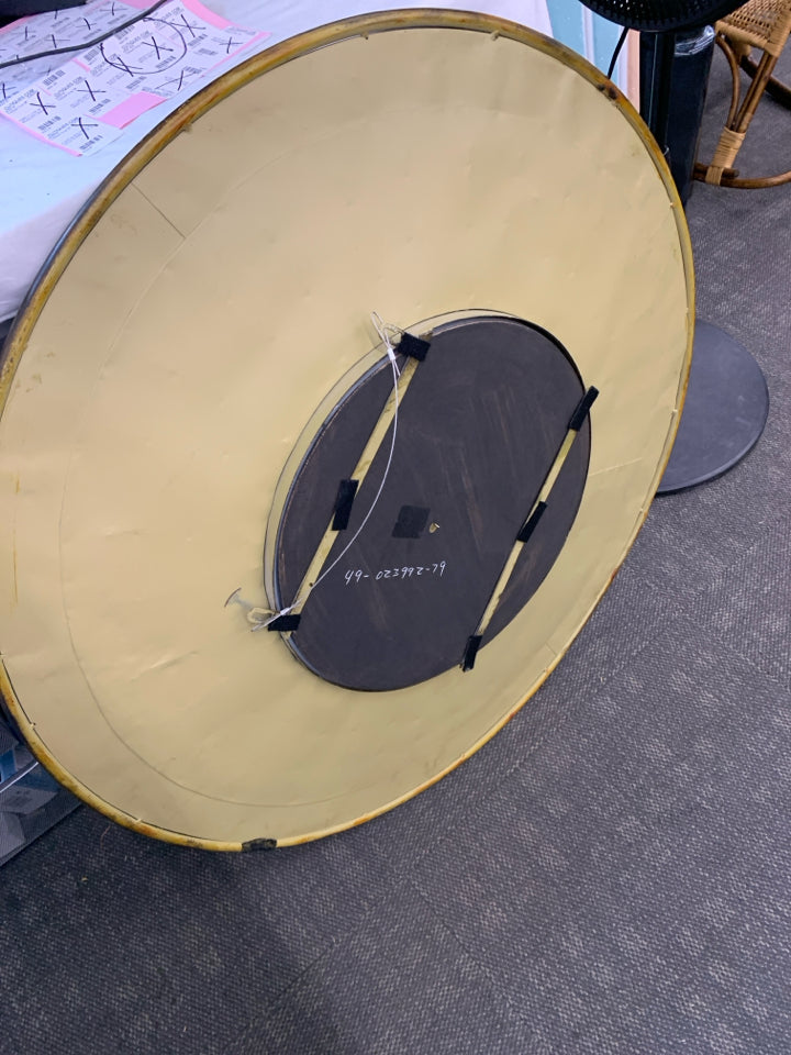 LARGE ROUND BRONZE METAL WALL MIRROR.