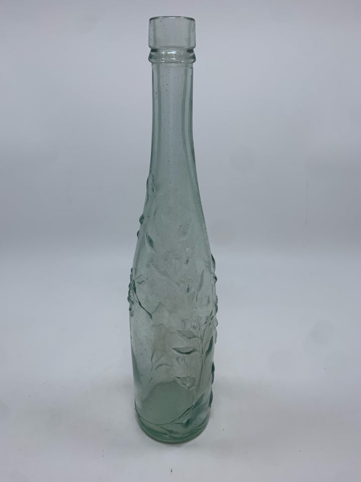 FLOWERS EMBOSSED CLEAR GLASS BOTTLE.