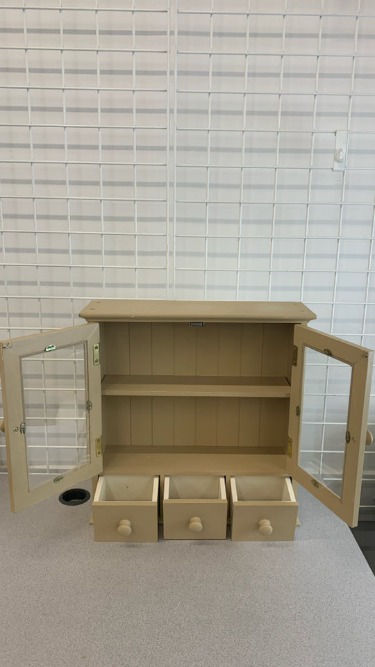 TAN PAINTED WOOD CABINET W/DOORS 3 DRAWERS.