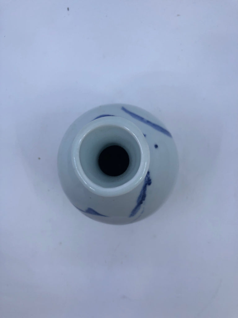 WHITE POTTERY VASE W/ BLUE DESIGNS.