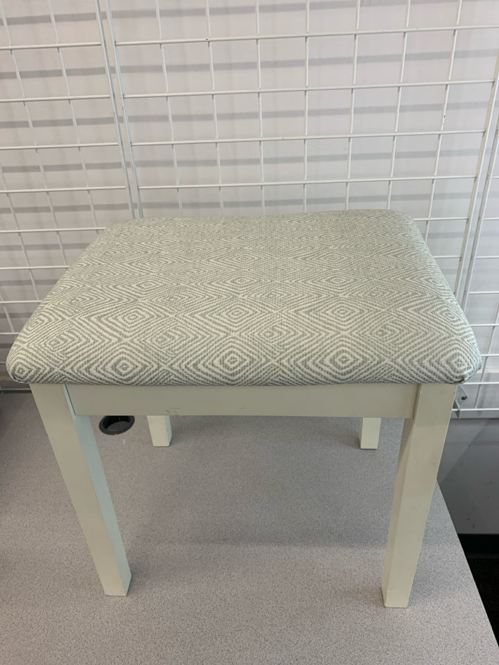 FOOT STOOL W/GEOMETRIC PATTERNED CUSHION.