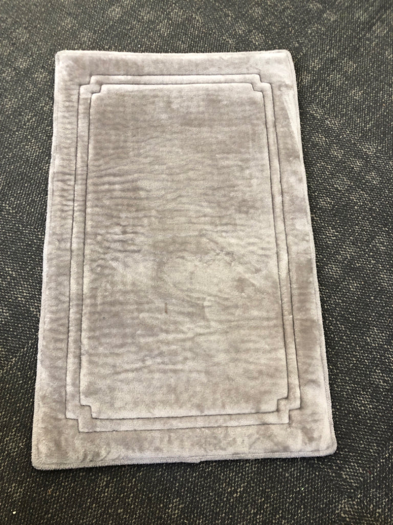 DARK GREY FOAM RUG.