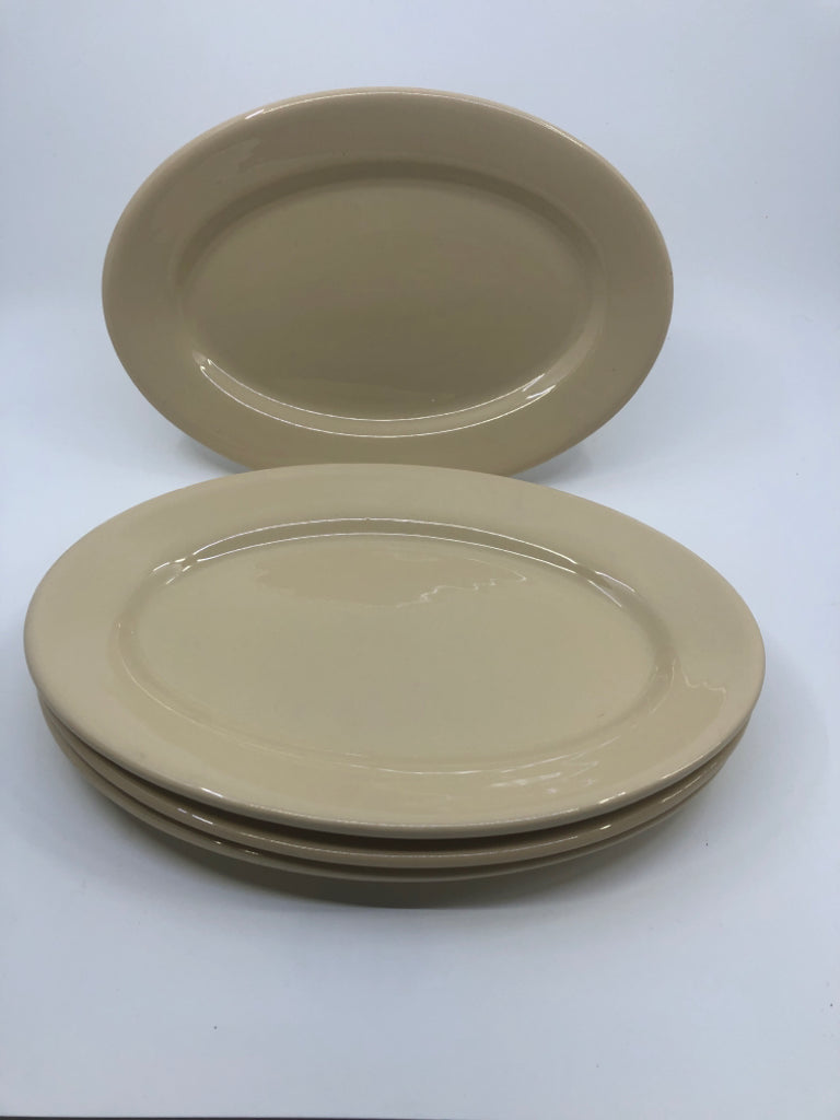 4 TAN OVAL DINNER PLATES.