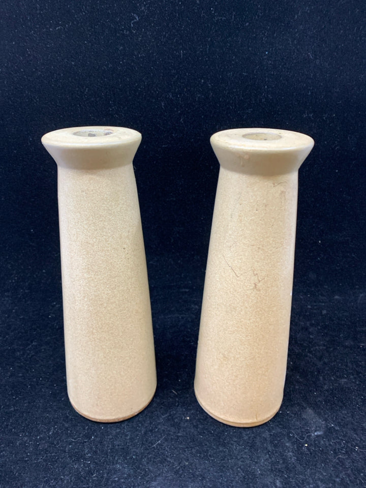 2 TAN CERAMIC TAPER CANDLE STICK HOLDERS.