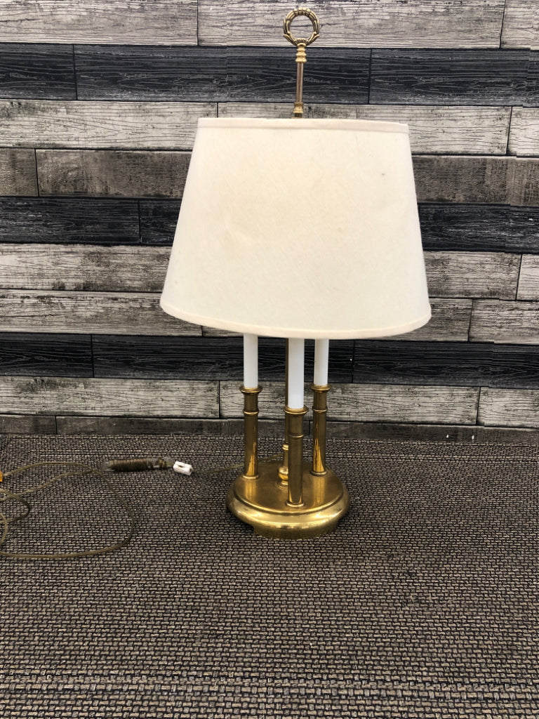 BRASS LAMP W/3 PILLARS AND CREAM SHADE.