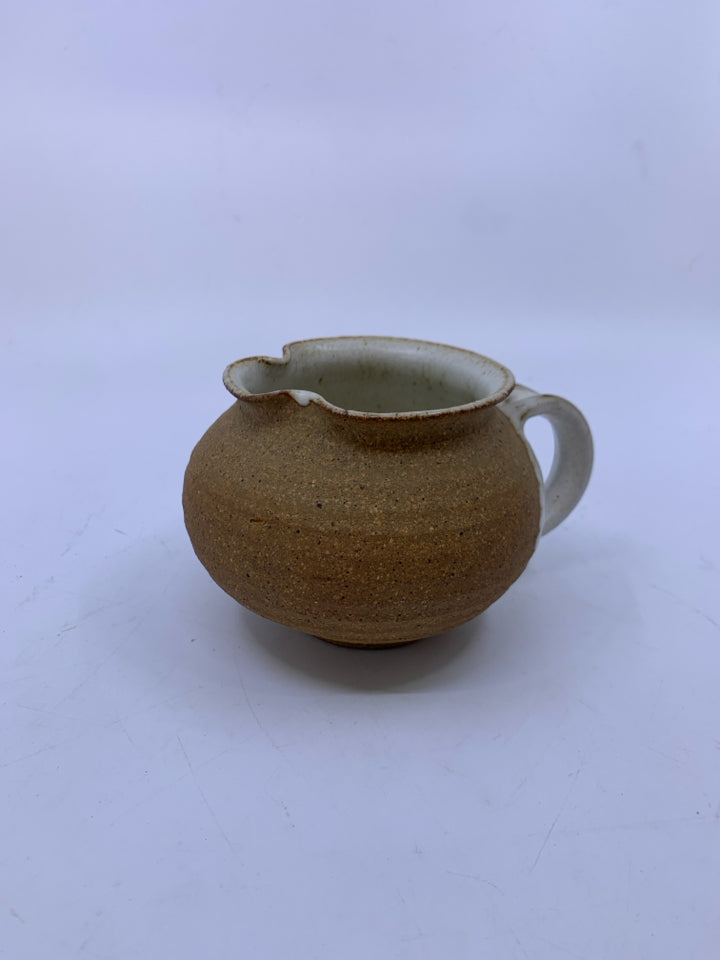 MATTE TAN CREAMER W/ WHITE SPECKLED SIDE/INSIDE POTTERY.