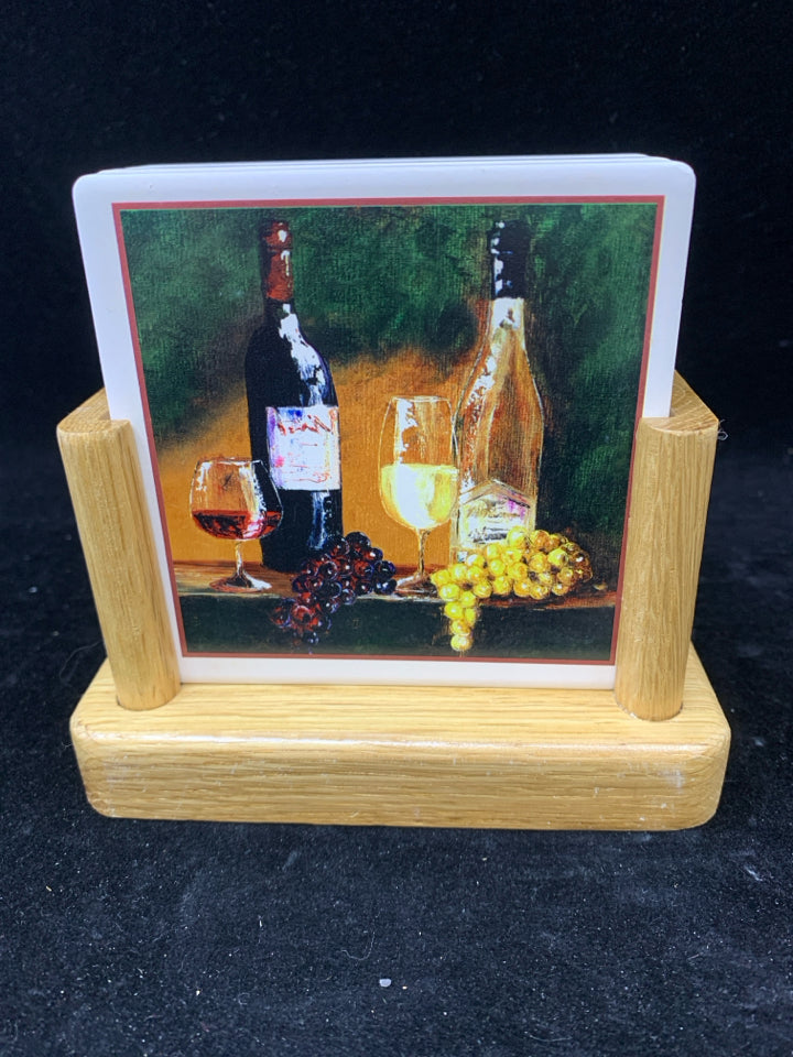 4 NIB WINE BOTTLES STONE COASTERS IN STAND.