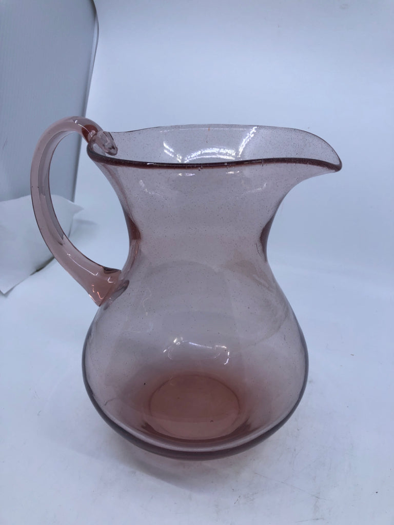 PINK GLASS PITCHER W/HANDLE.