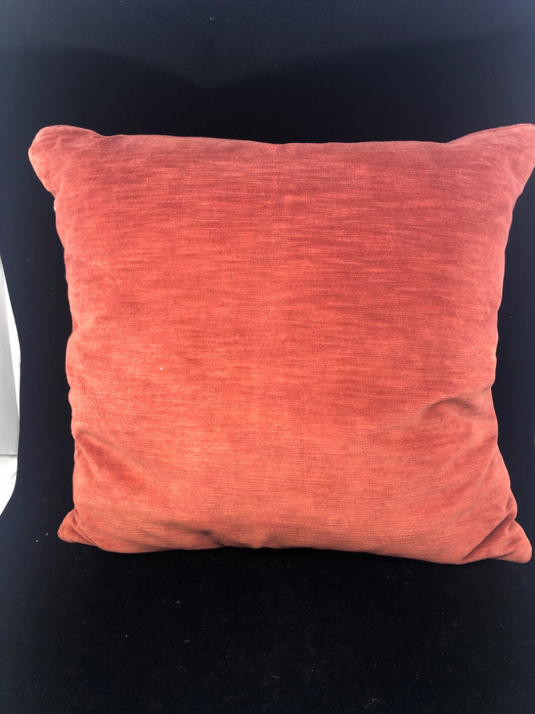 SMALL RED ORANGE ACCENT PILLOW.