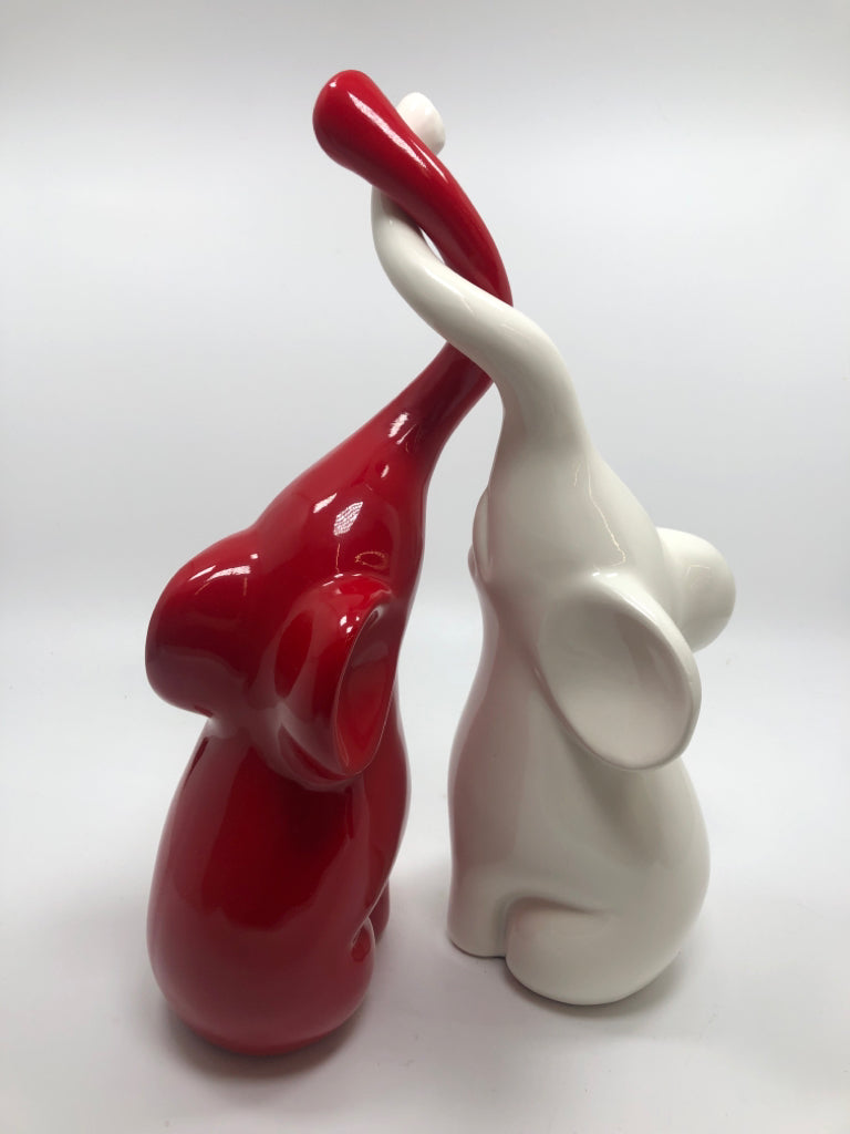 2PC RED/WHITE ELEPHANT SCULPTURE HUGGING.