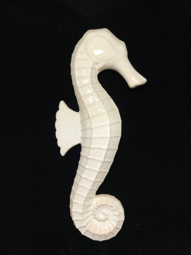 WHITE GLAZED CERAMIC SEAHORSE.