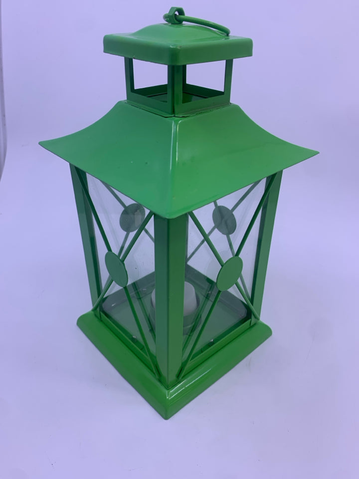 GREEN METAL TEA LIGHT LANTERN.