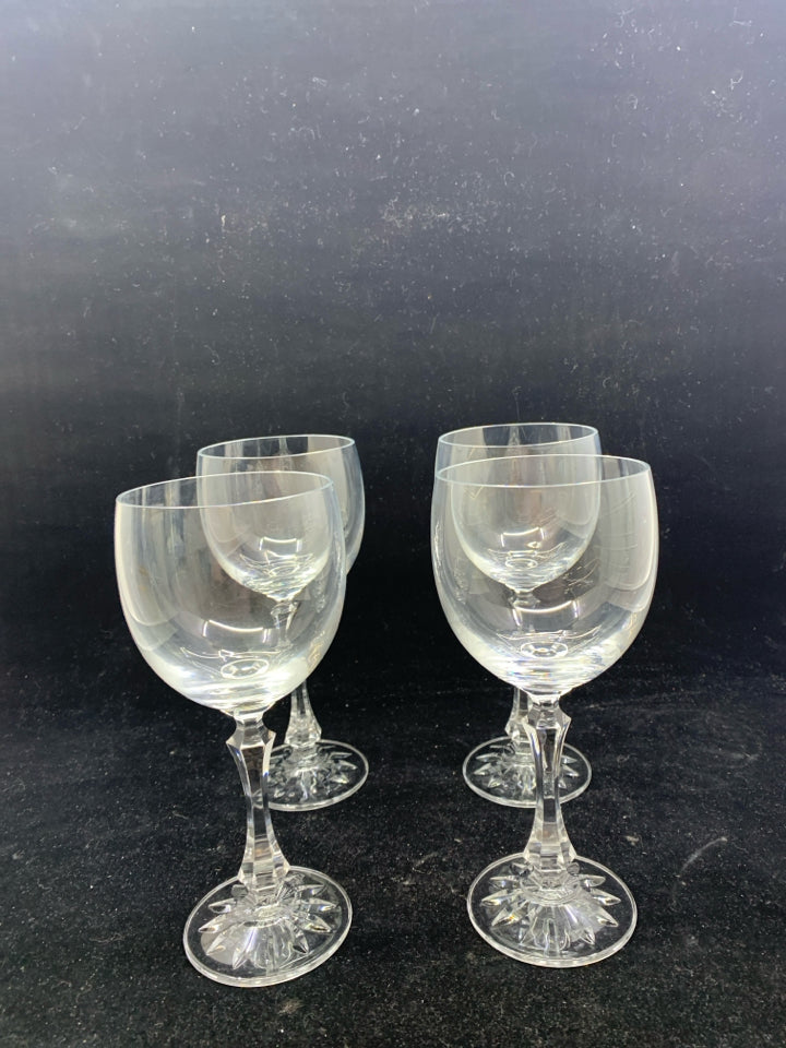 4 MEDIUM SIZED HEAVY CRYSTAL WINE GLASSES.