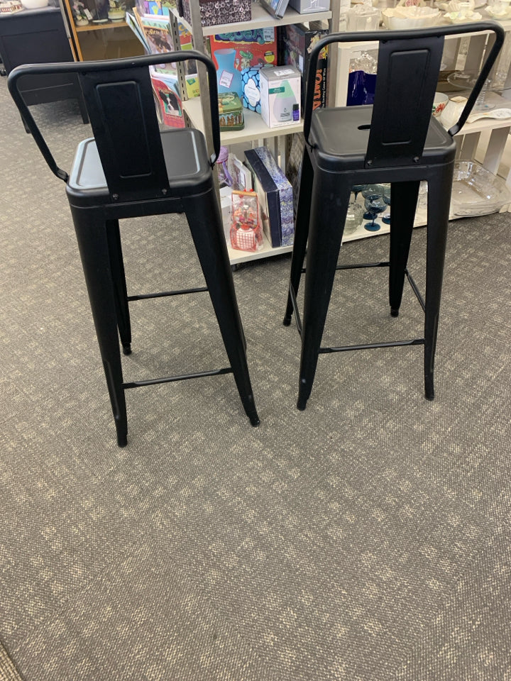 2 BLACK METAL LOW BACK STOOLS.