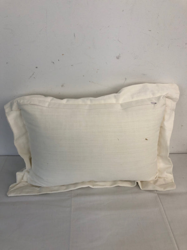 WHITE PILLOW W/ LIGHT BLUE DESIGNS.