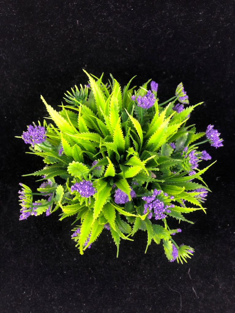 FAUX LAVENDER IN STONE PLANTER.