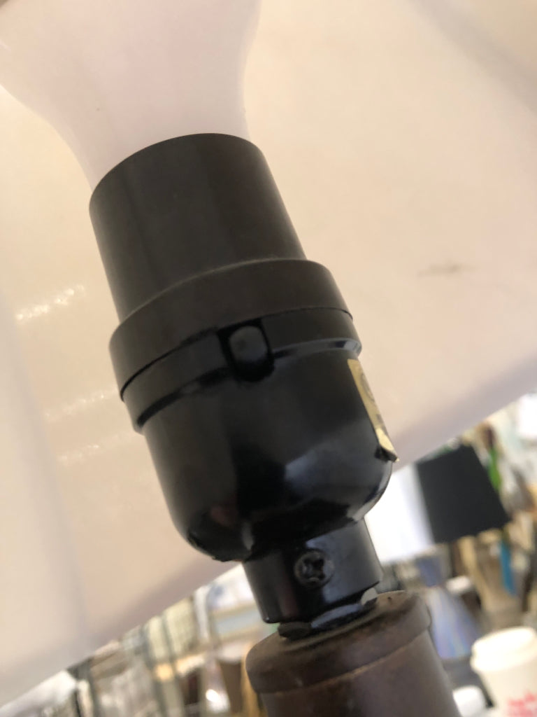 DARK WOOD BASE LAMP W/TAN FABRIC SHADE.