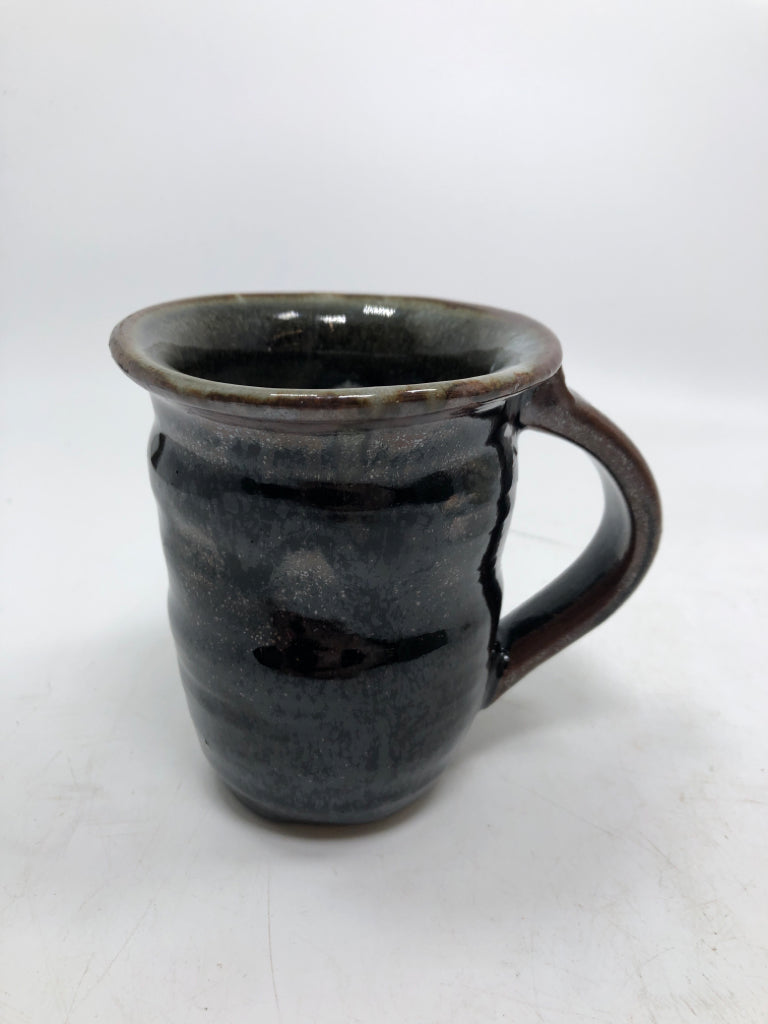 HAND SPUN BLACK GLAZED POTTERY MUG.