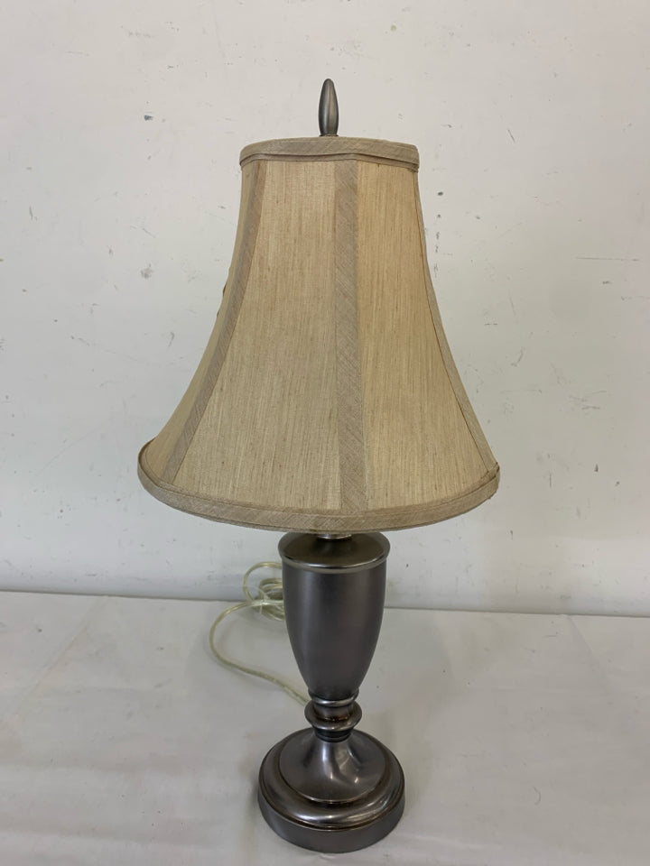 SHORT SILVER BASE LAMP W/ CREAM+TAN SHADE.