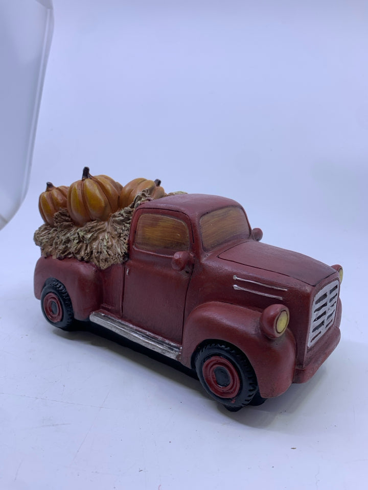RED CERAMIC TRUCK WITH PUMPKINS/SUNFLOWERS.