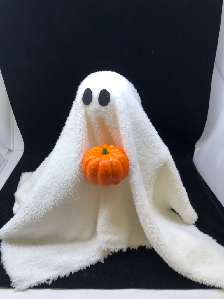 PLUSH GHOST HOLDING ORANGE PUMPKIN.