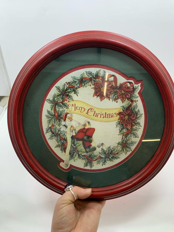 CIRCLE MERRY CHRISTMAS SANTA SITTING ON WREATH WALL HANGING.