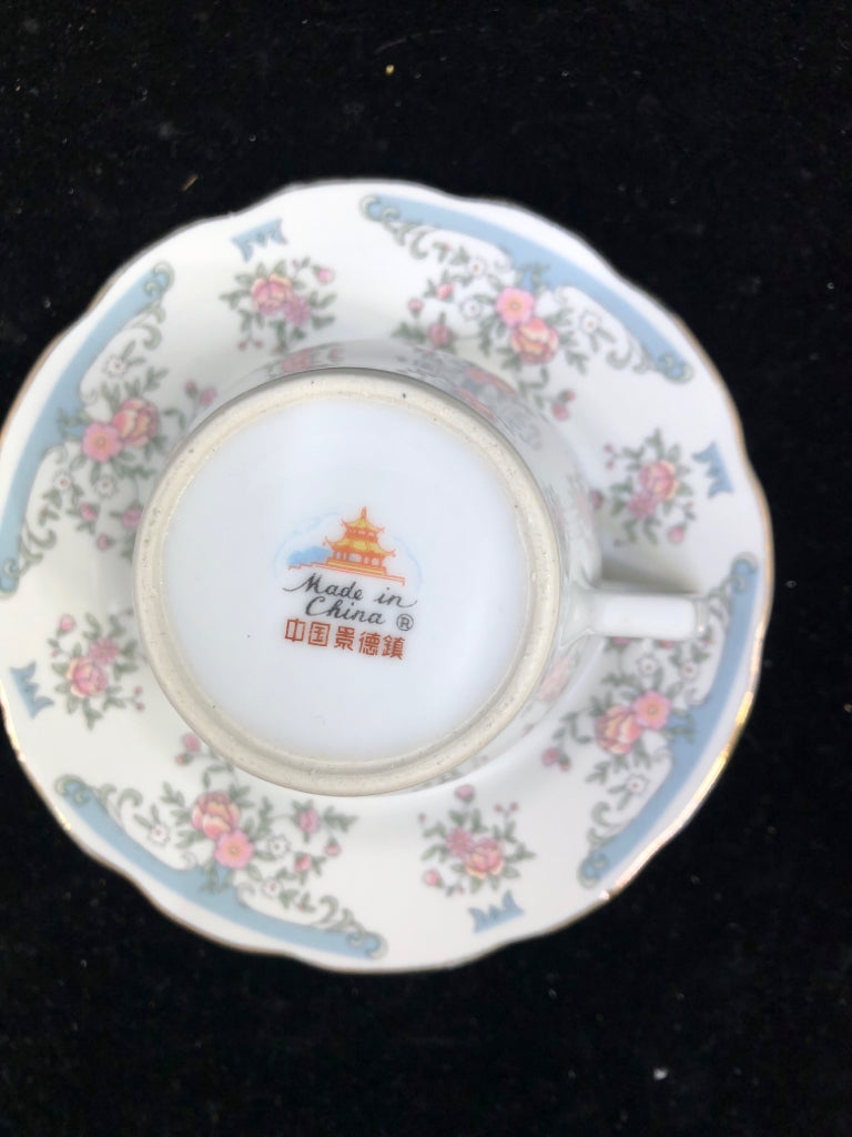PALE BLUE W PINK FLORAL TEACUP AND SAUCER.
