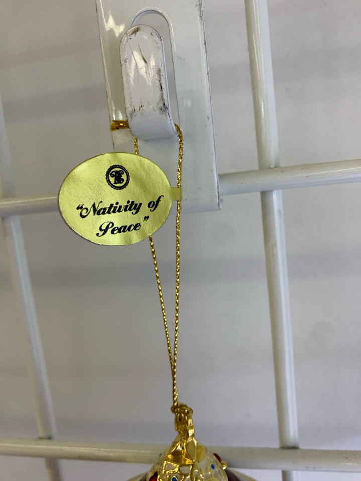 CERAMIC NATIVITY OF PEACE ORNAMENT.