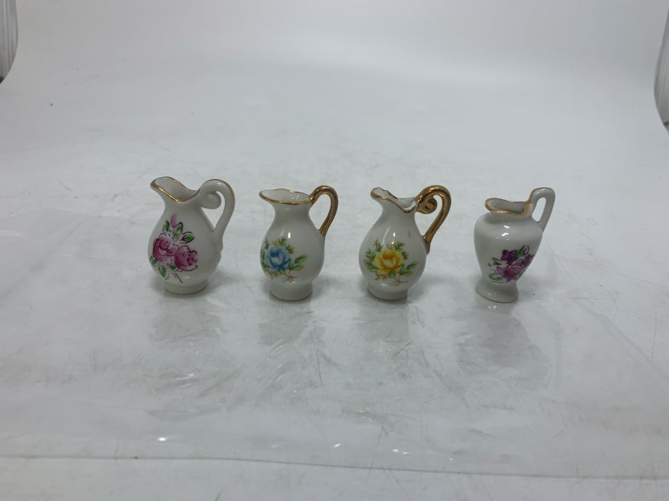 4 MINI PITCHERS W/ ASSORTED FLOWERS IN BAG.