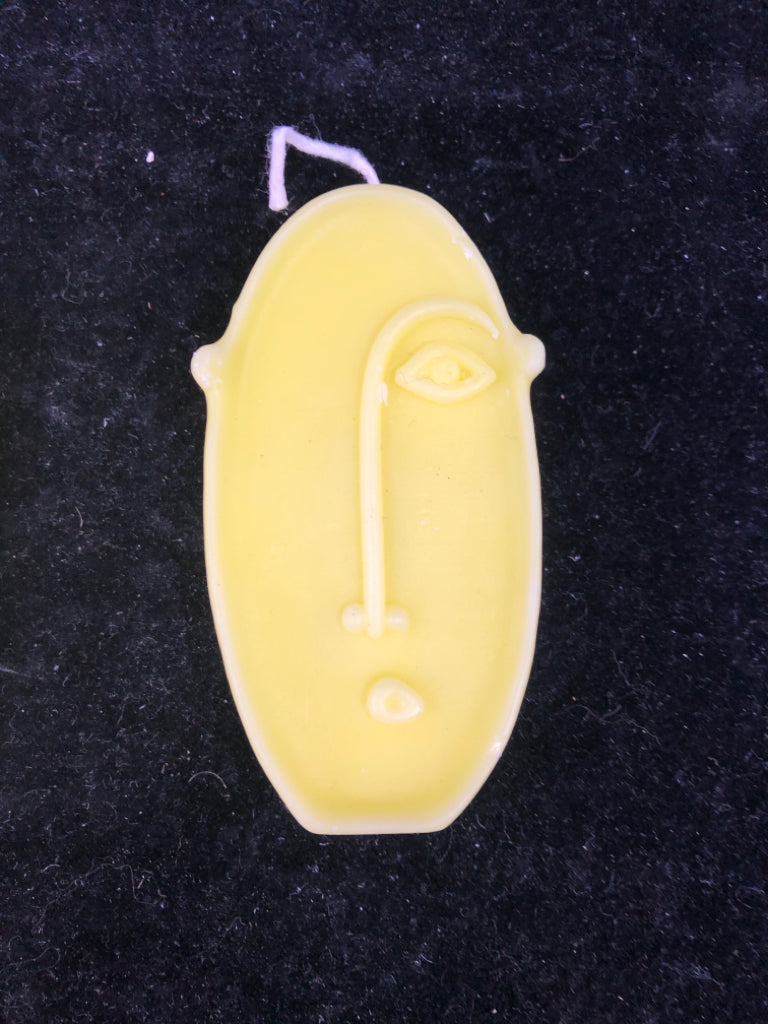 3 ABSTRACT FACE SHAPED CANDLES.