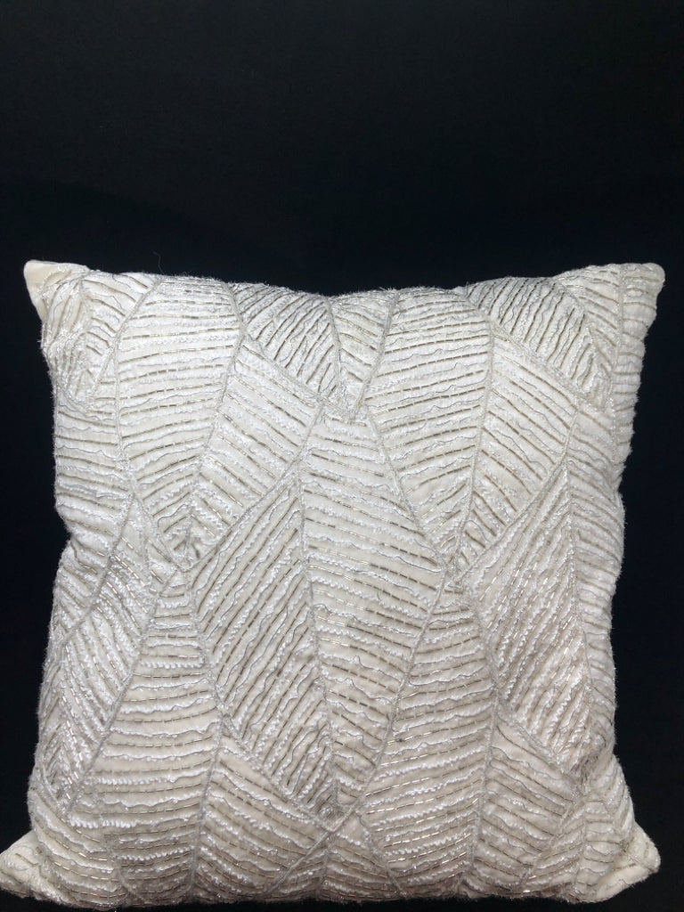 BEADED WHITE PILLOW.