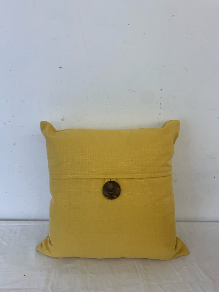 MUSTARD YELLOW PILLOW W/ BUTTON.