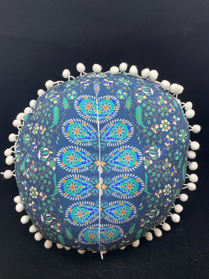 BLUE MEDALLION ACCENT PILLOW W/WHITE POM POMS.