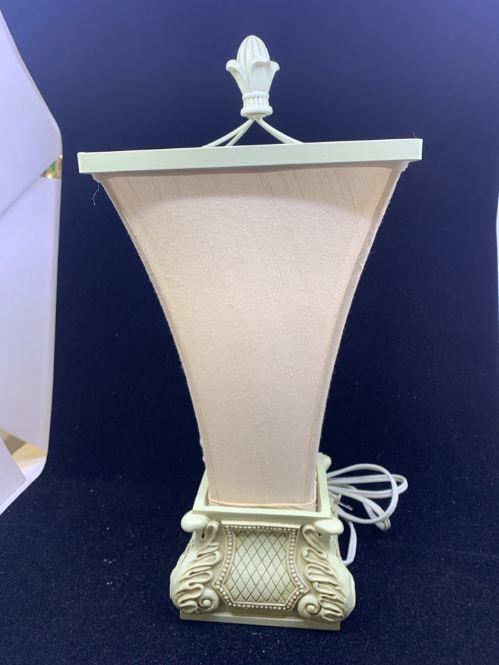 SCROLL BASE LAMP WITH CREAM FLARED TOP SHADE.