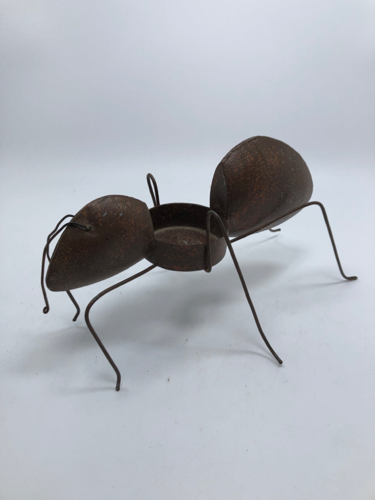 RUSTIC WELDED ANT CANDLE HOLDER.