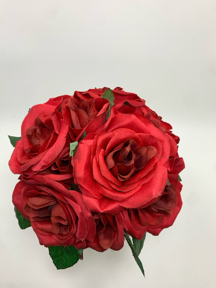RED ROSES IN WHITE URN VASE.