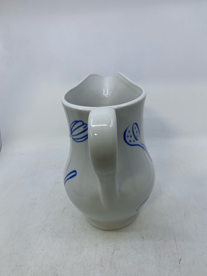 CERAMIC W/ ASSORTED BLUE UTENSILS.