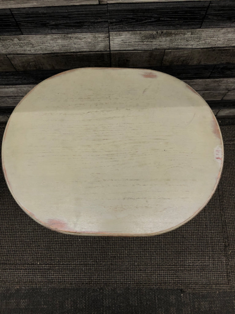 OVAL GREEN TINT DISTRESSED FOOTED SIDE TABLE.